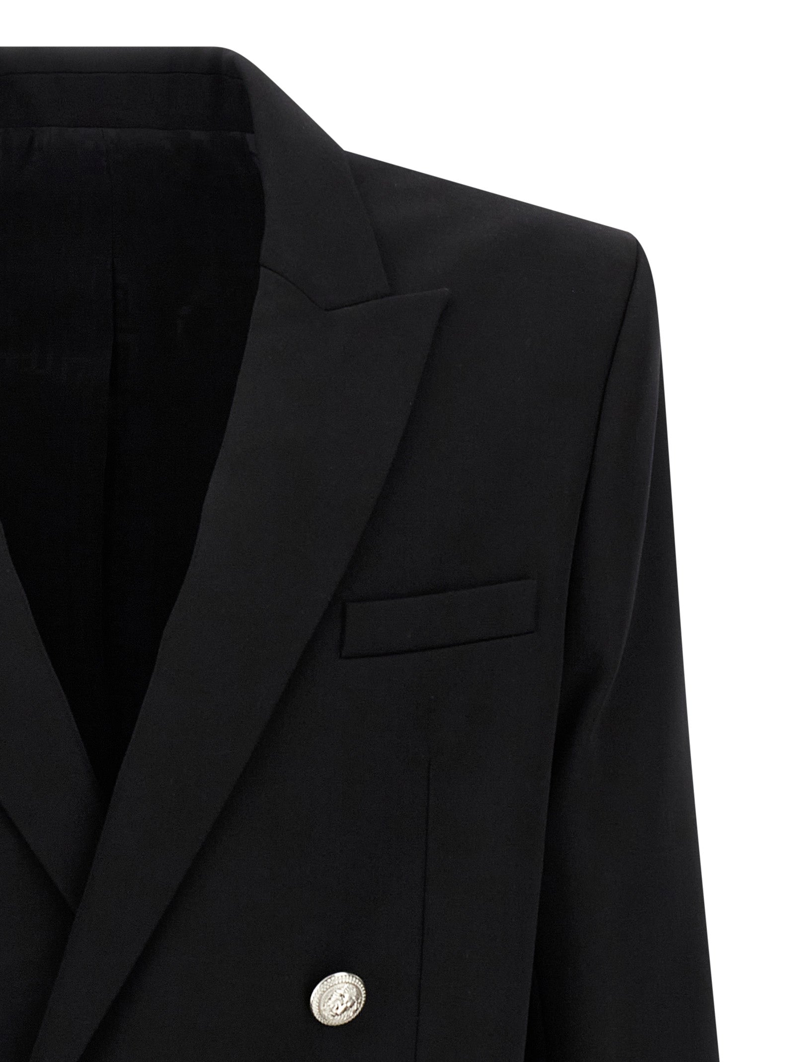 Veste blazer noire en laine vierge Balmain avec coupe élégante, boutons dorés et détails sophistiqués visibles sur l'image.