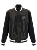 Veste en cuir bicolore en agneau de Balmain, coupe moderne, détails sophistiqués, visible en gros plan sur l'image.