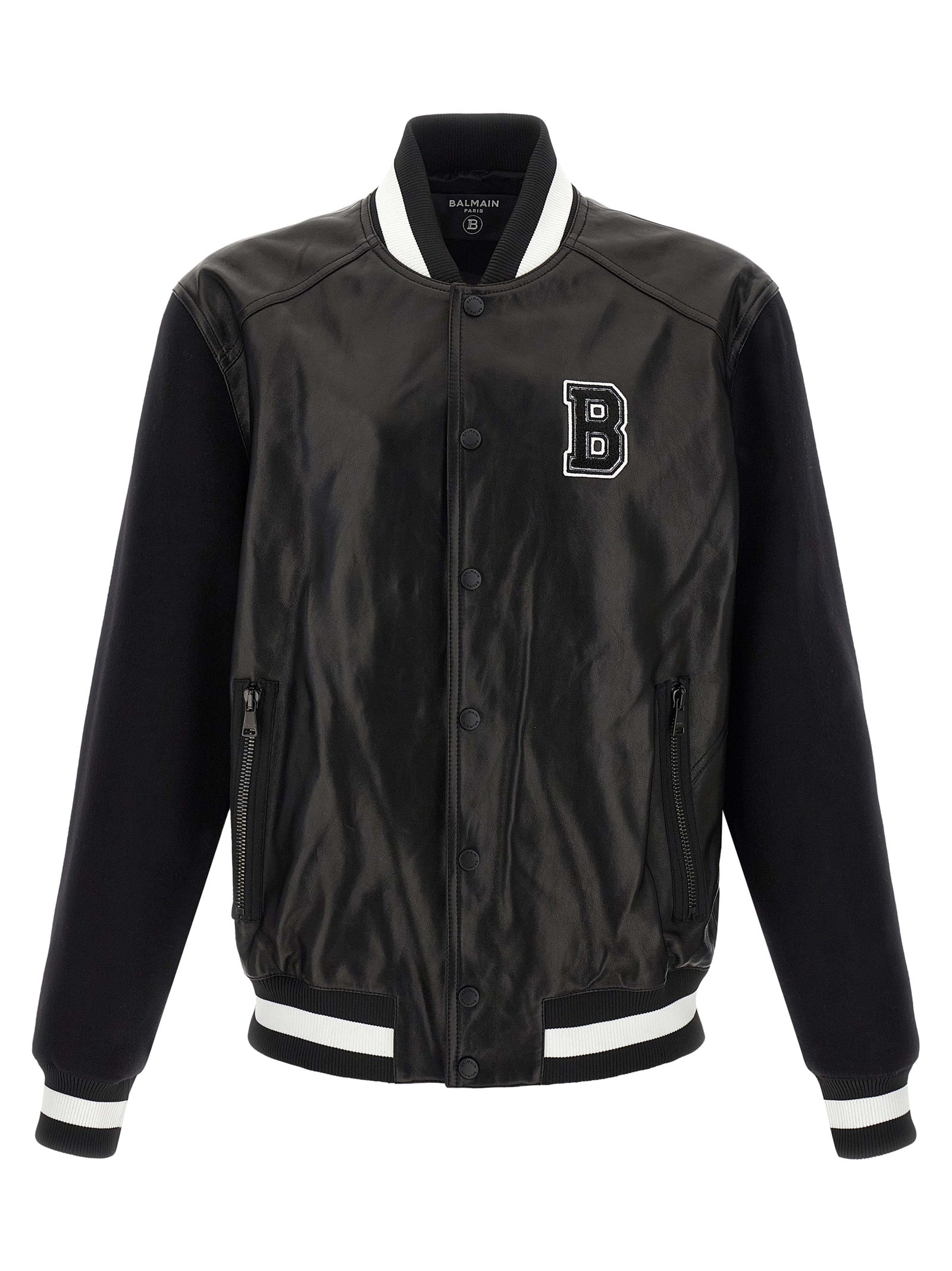 Veste en cuir bicolore en agneau de Balmain, coupe moderne, détails sophistiqués, visible en gros plan sur l'image.