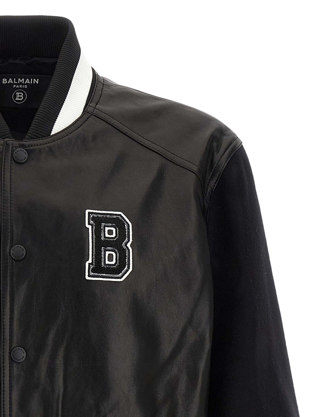 Veste en cuir d'agneau bicolore Balmain, style élégant et moderne, avec détails sophistiqués et coupe ajustée.