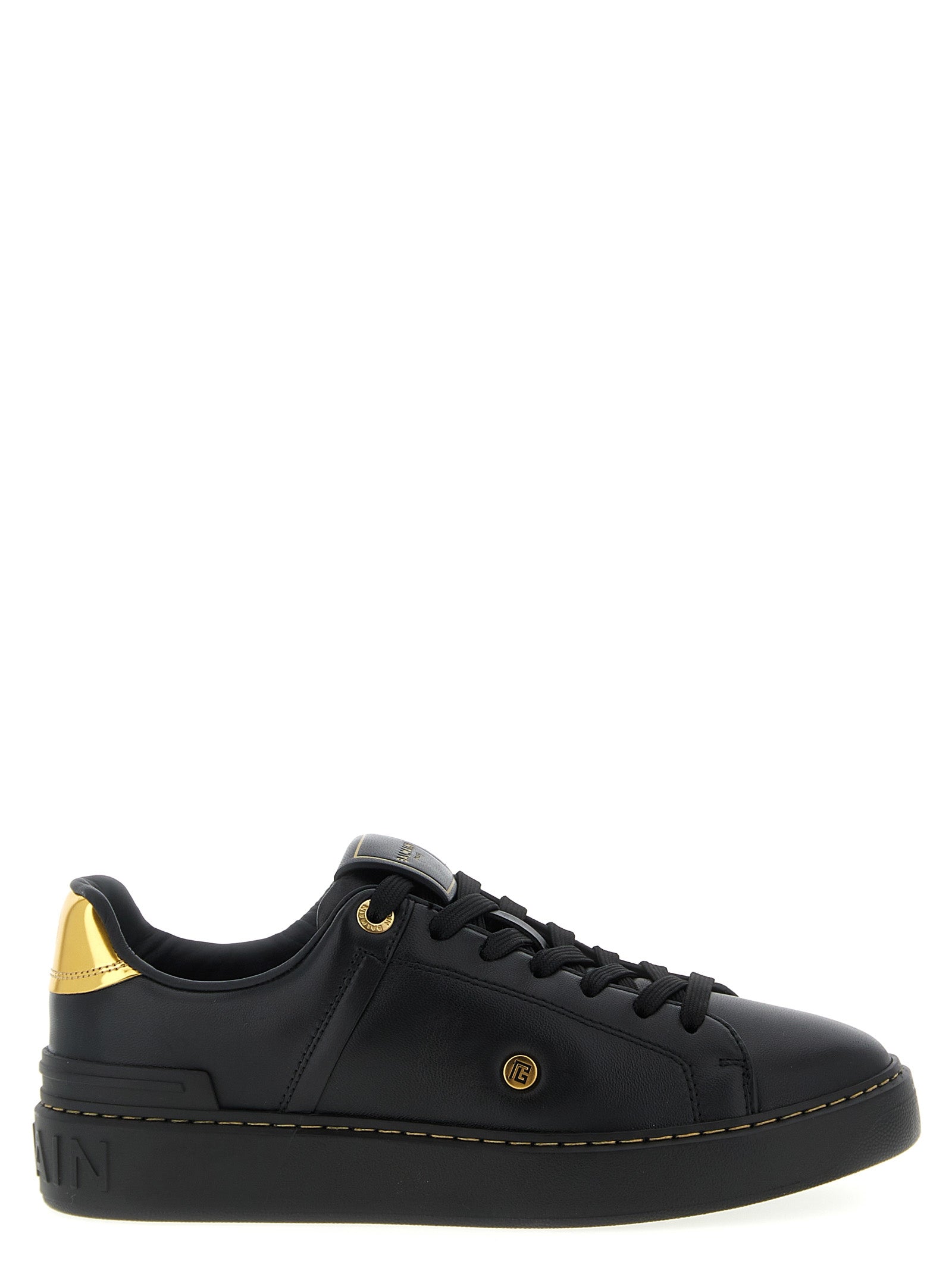 Chaussures Balmain en cuir d'agneau noir, baskets basses élégantes avec design moderne et détails sophistiqués.