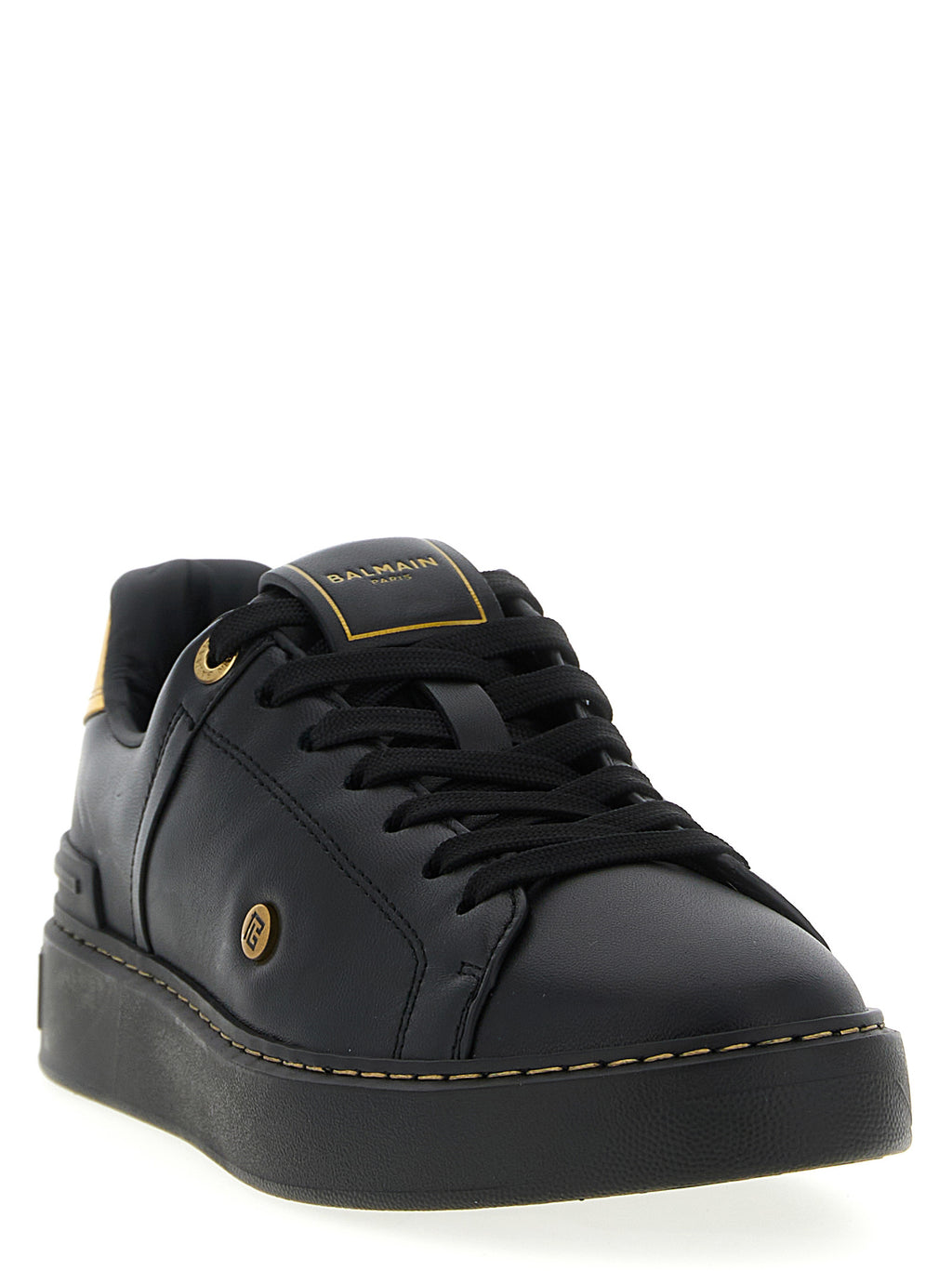 Sneakers basses Balmain en cuir d'agneau noir, style décontracté avec semelle blanche, vue de face.