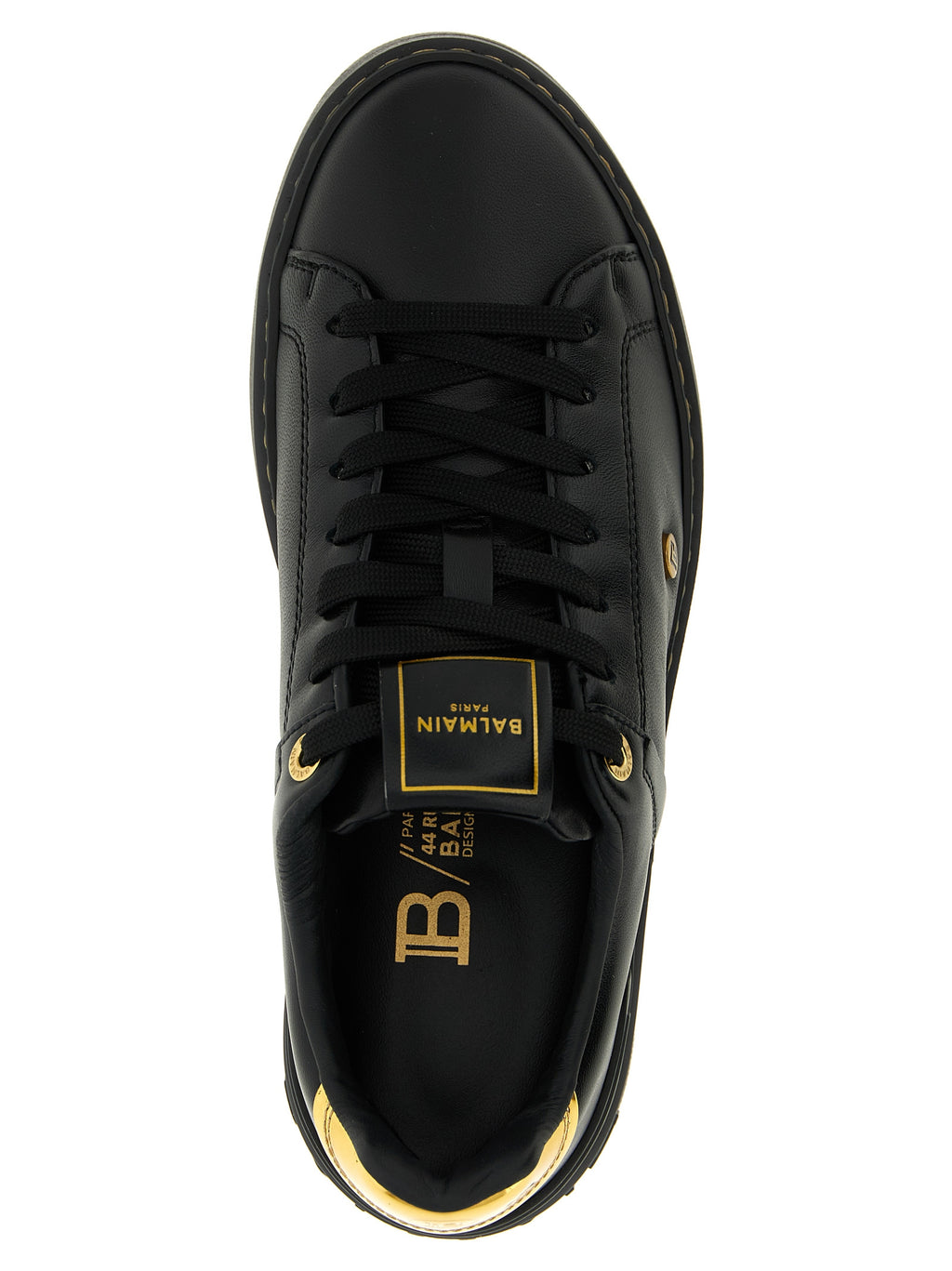 Sneakers basses en cuir d'agneau noir Balmain, style décontracté avec semelle blanche et design élégant.