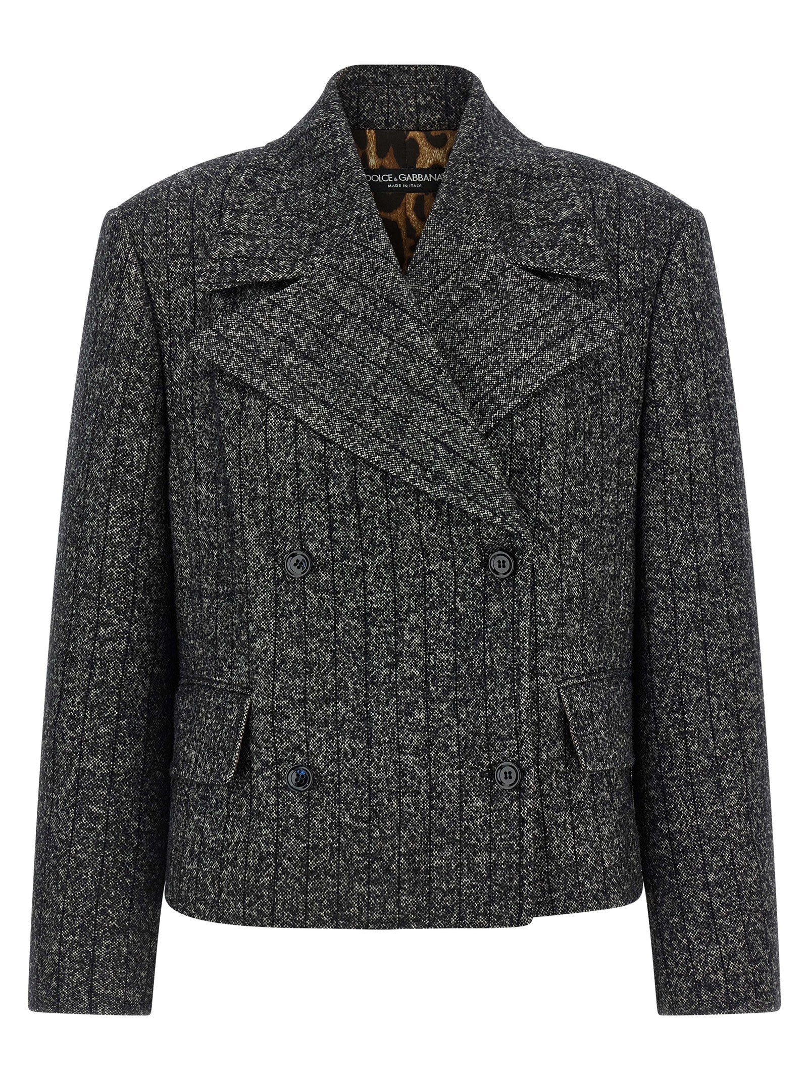 Blazer bicolore en élasthanne de Dolce & Gabbana, coupe élégante avec détails modernes, porté sur un mannequin.