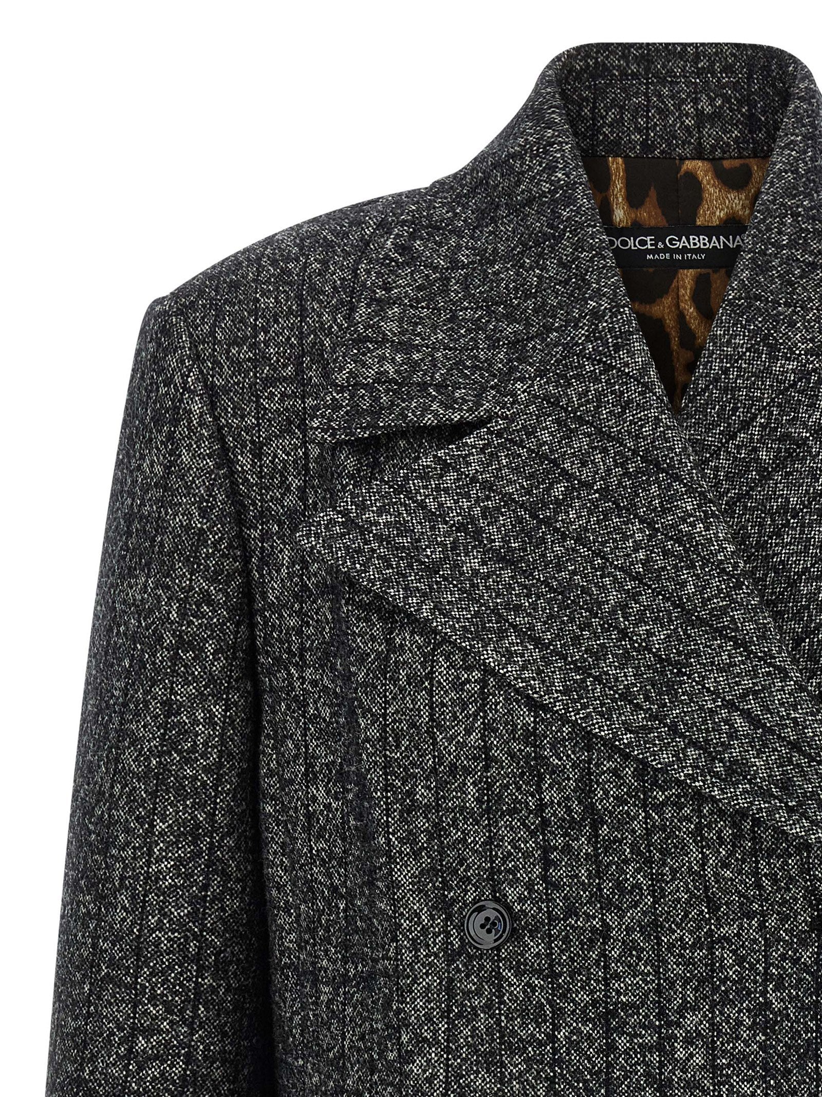 Blazer bicolore en élasthanne Dolce & Gabbana, coupe ajustée, avec détails élégants et boutons sophistiqués, porté sur un mannequin.