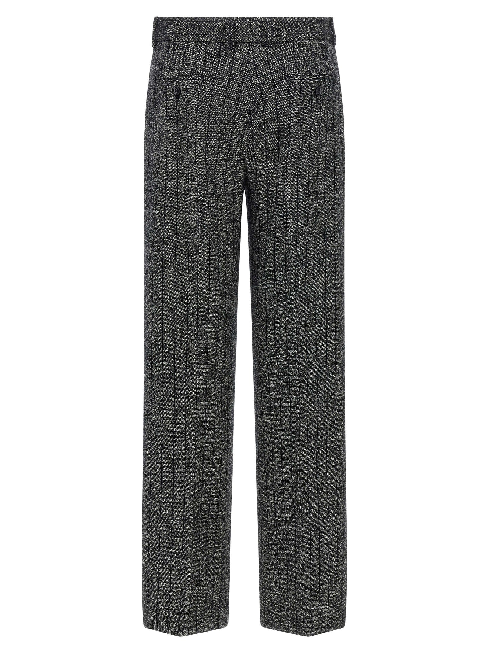 Pantalons décontractés en laine vierge bicolore de Dolce & Gabbana, style élégant et confortable, visibles en gros plan.