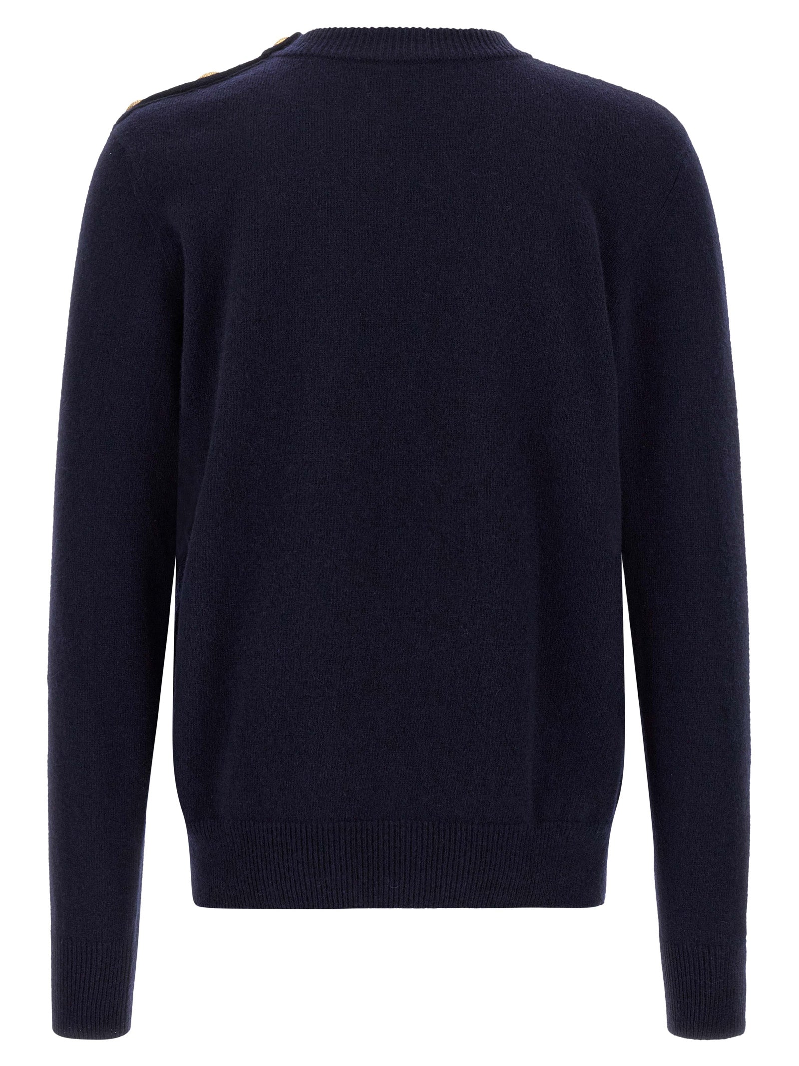 Cardigan en cachemire bleu Balmain porté, avec boutons et coupe élégante, visible dans une image claire et détaillée.