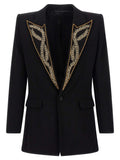 Blazer noir en viscose de la marque Balmain, coupe élégante avec boutons dorés, porté sur un mannequin.