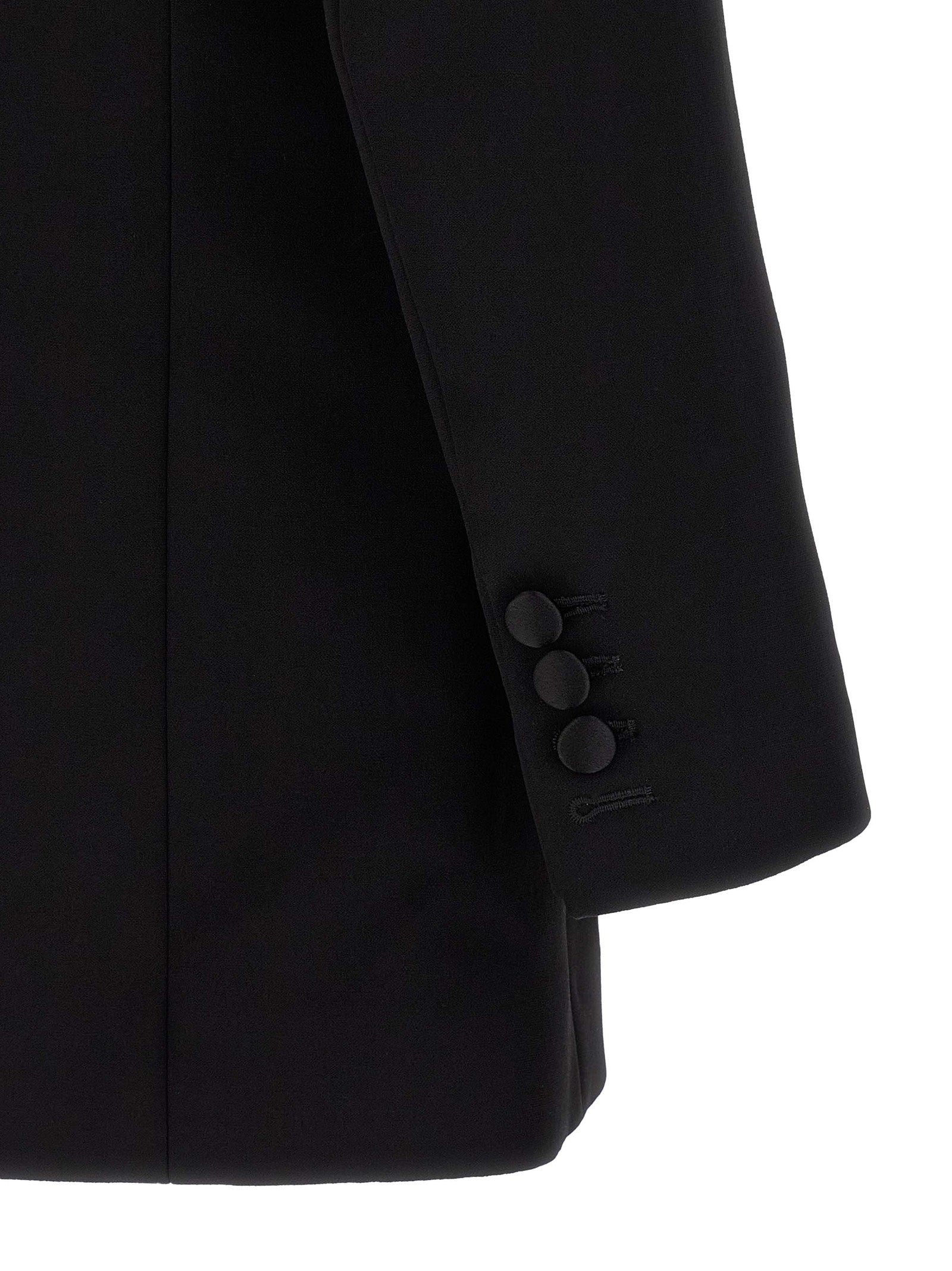 Veste blazer noire en viscose de la marque Balmain, coupe élégante et moderne, portée sur un fond neutre.