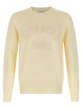 Cardigan en coton beige Givenchy avec boutons, porté décontracté, détail du tissu doux et fini élégant.