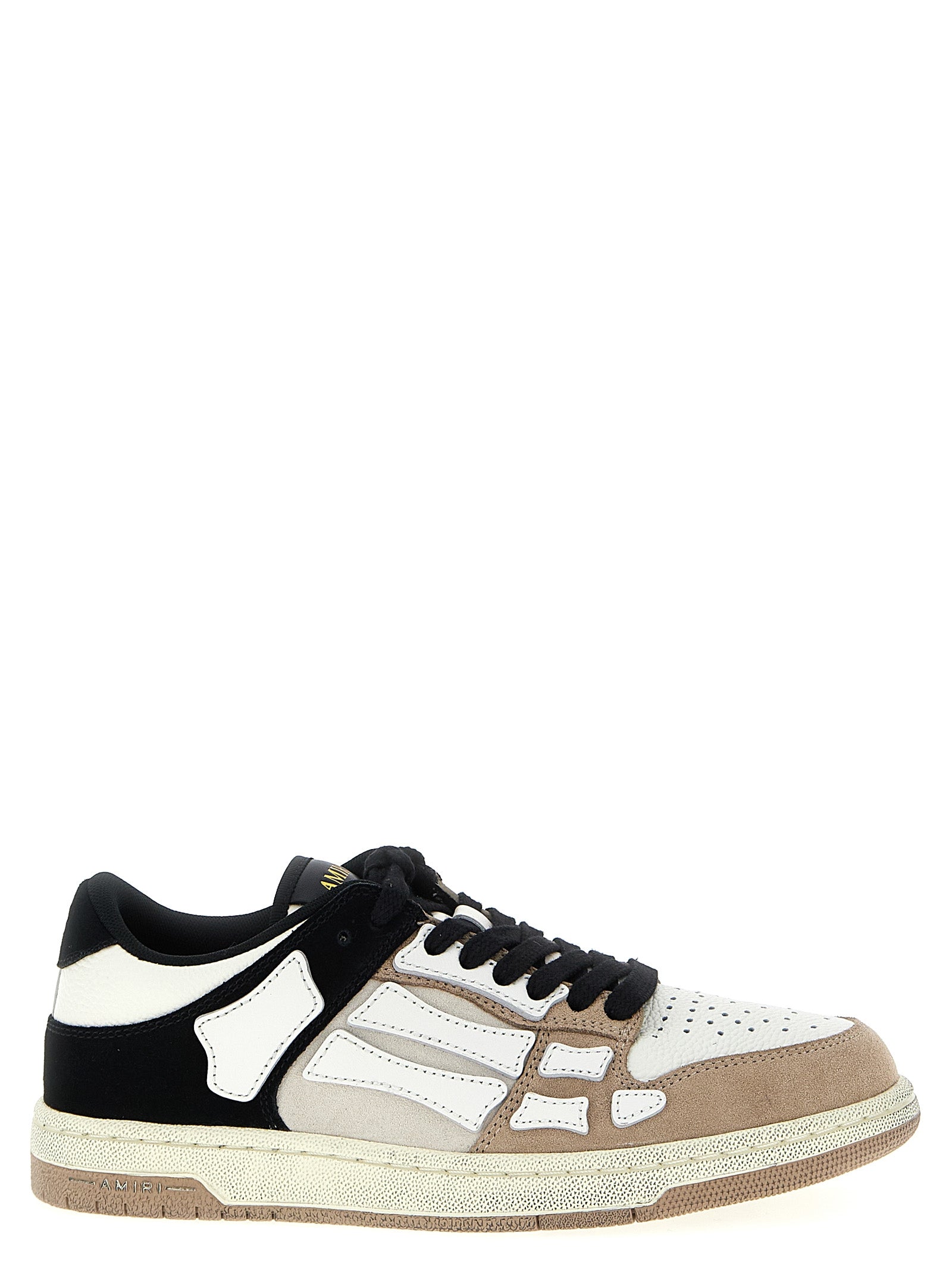 Sneakers basses Amiri en cuir de vache multicolore, style décontracté et tendance, visibles en gros plan.
