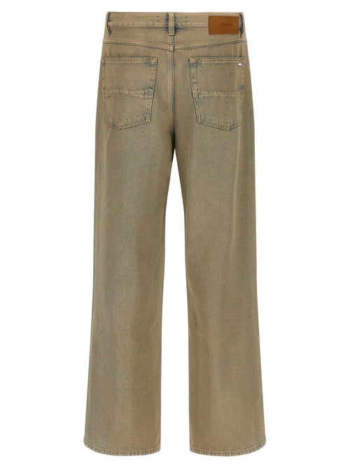 Jeans beige en coton de coupe droite de la marque Amiri, montrant la texture du tissu et la coupe classique.