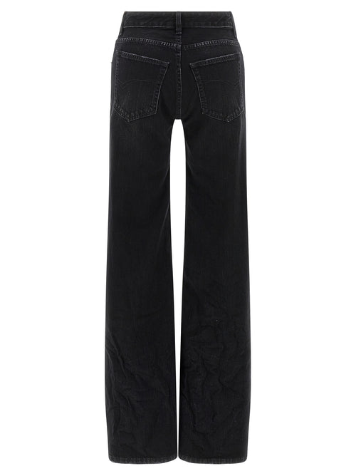 Jeans évasés noirs en coton de la marque Balenciaga, style décontracté et tendance, avec coupe fluide et détails modernes.