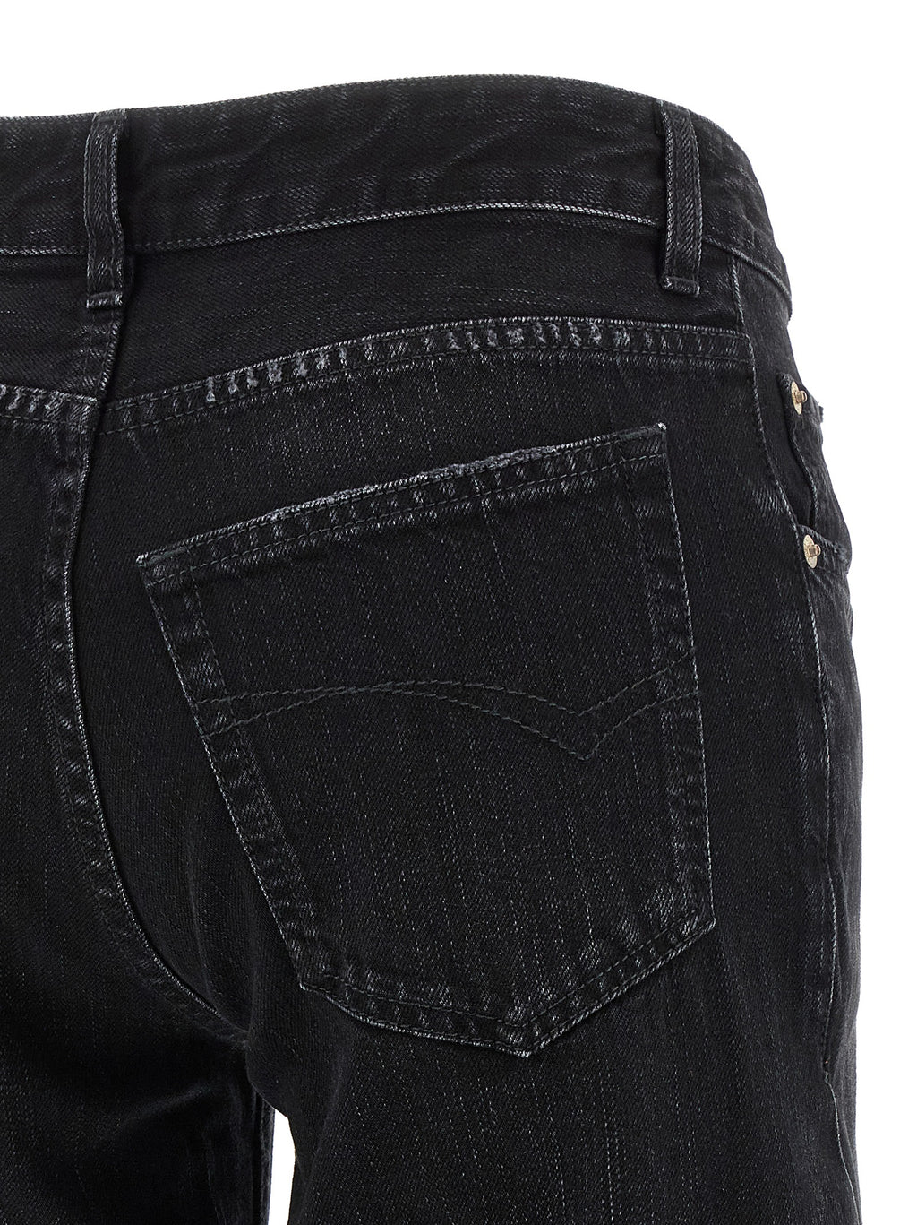 Jeans évasés en coton noir de la marque Balenciaga, coupe ample et style tendance, visible en détail sur l'image.
