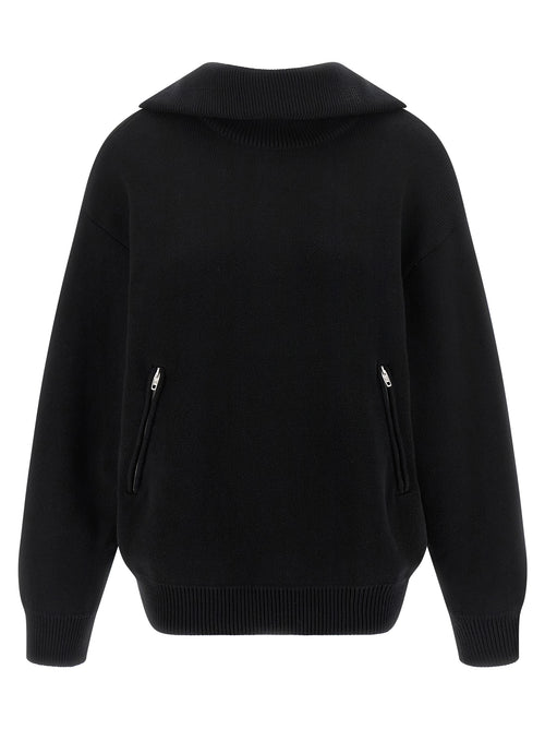 Cardigan en coton noir de Balenciaga, détails du tissu et coupe élégante visible sur l'image.