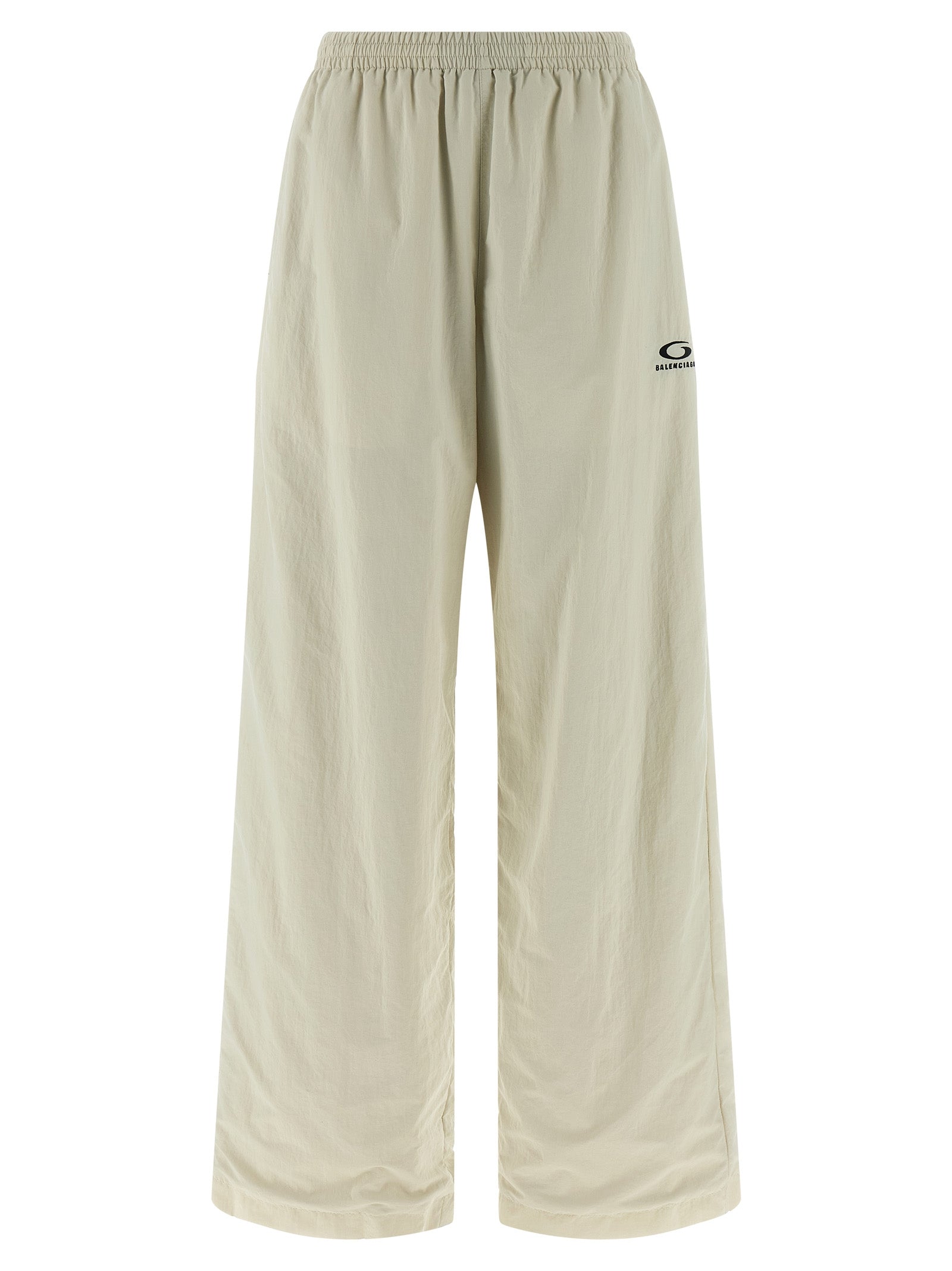 Pantalons de jogging beige en polyamide de Balenciaga, style décontracté, avec ceinture élastique et poches latérales visibles.
