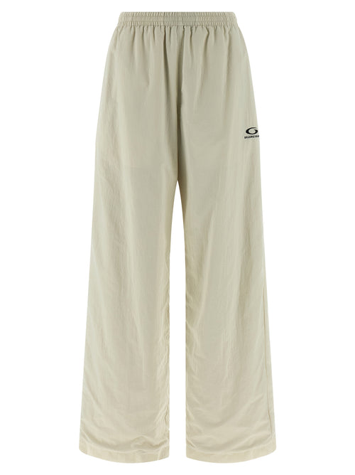 Pantalons de jogging beige en polyamide de Balenciaga, style décontracté, avec ceinture élastique et poches latérales visibles.