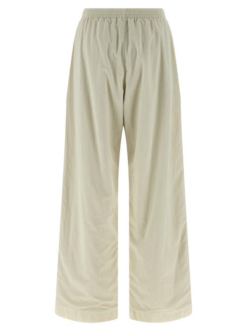 Pantalons de jogging beige en polyamide Balenciaga, style décontracté pour le sport ou la détente, avec détails modernes.