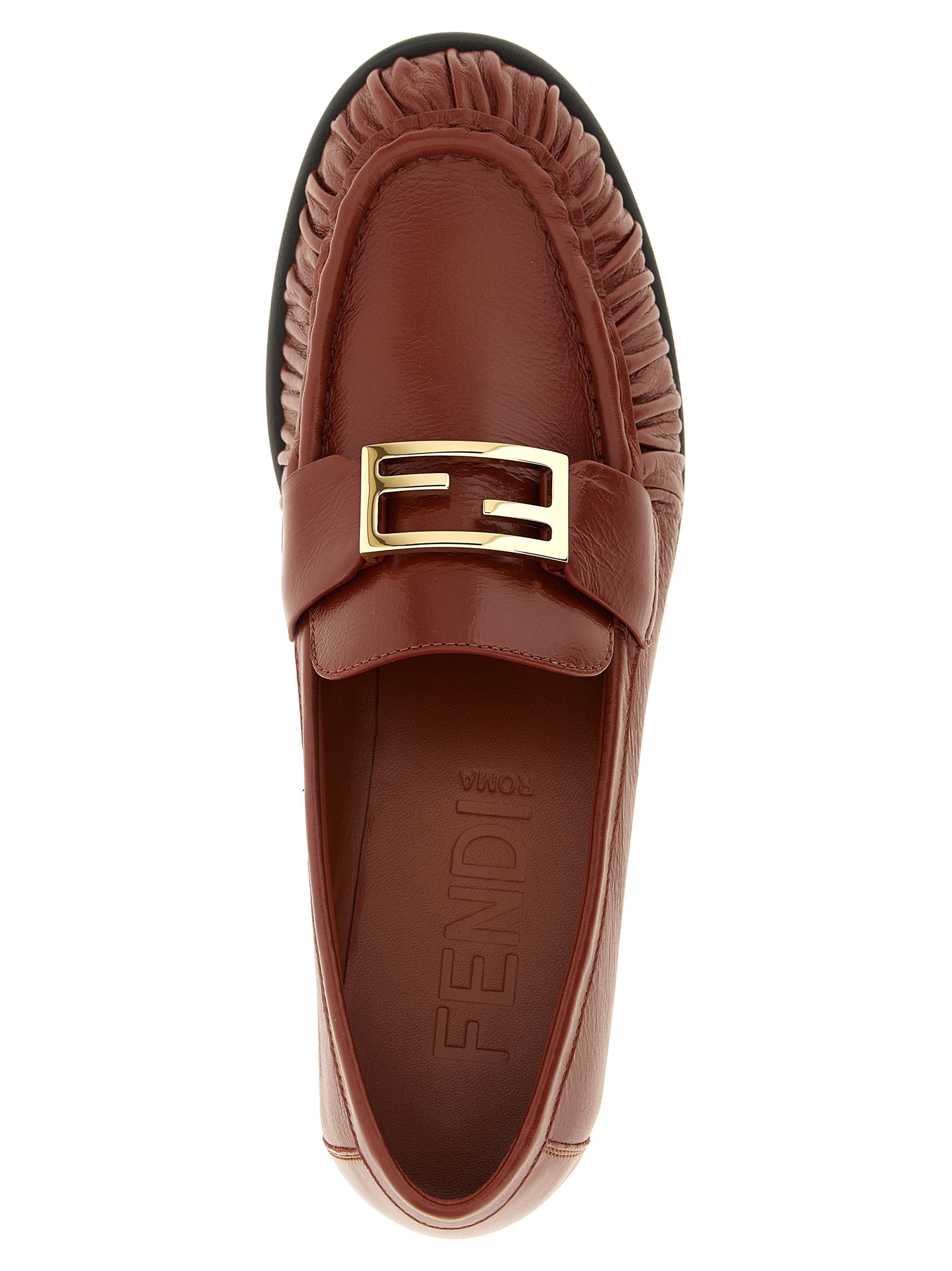 Mocassins Fendi en cuir d'agneau marron à enfiler, style élégant et confortable, visibles de face avec détails de la marque.