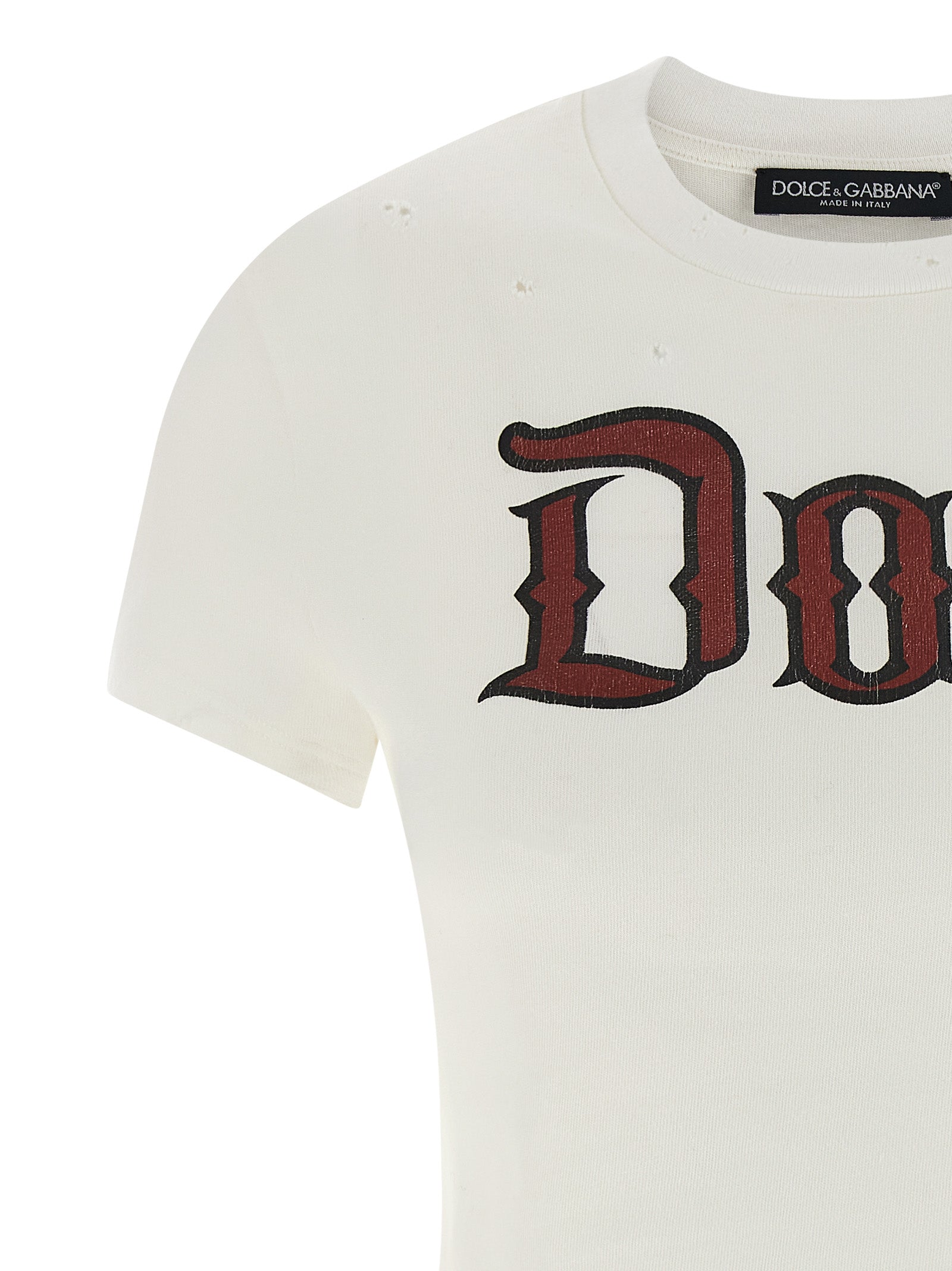 T-shirt blanc en coton de Dolce & Gabbana, style décontracté avec logo en relief, porté sur mannequin.