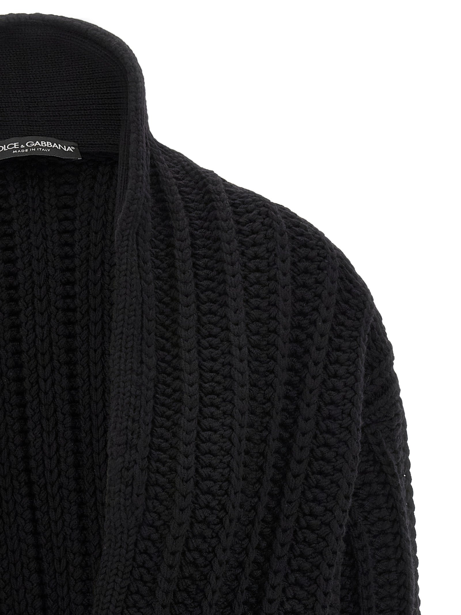 Cardigan noir en laine vierge de Dolce & Gabbana, vue de face, avec détails de fabrication visibles.