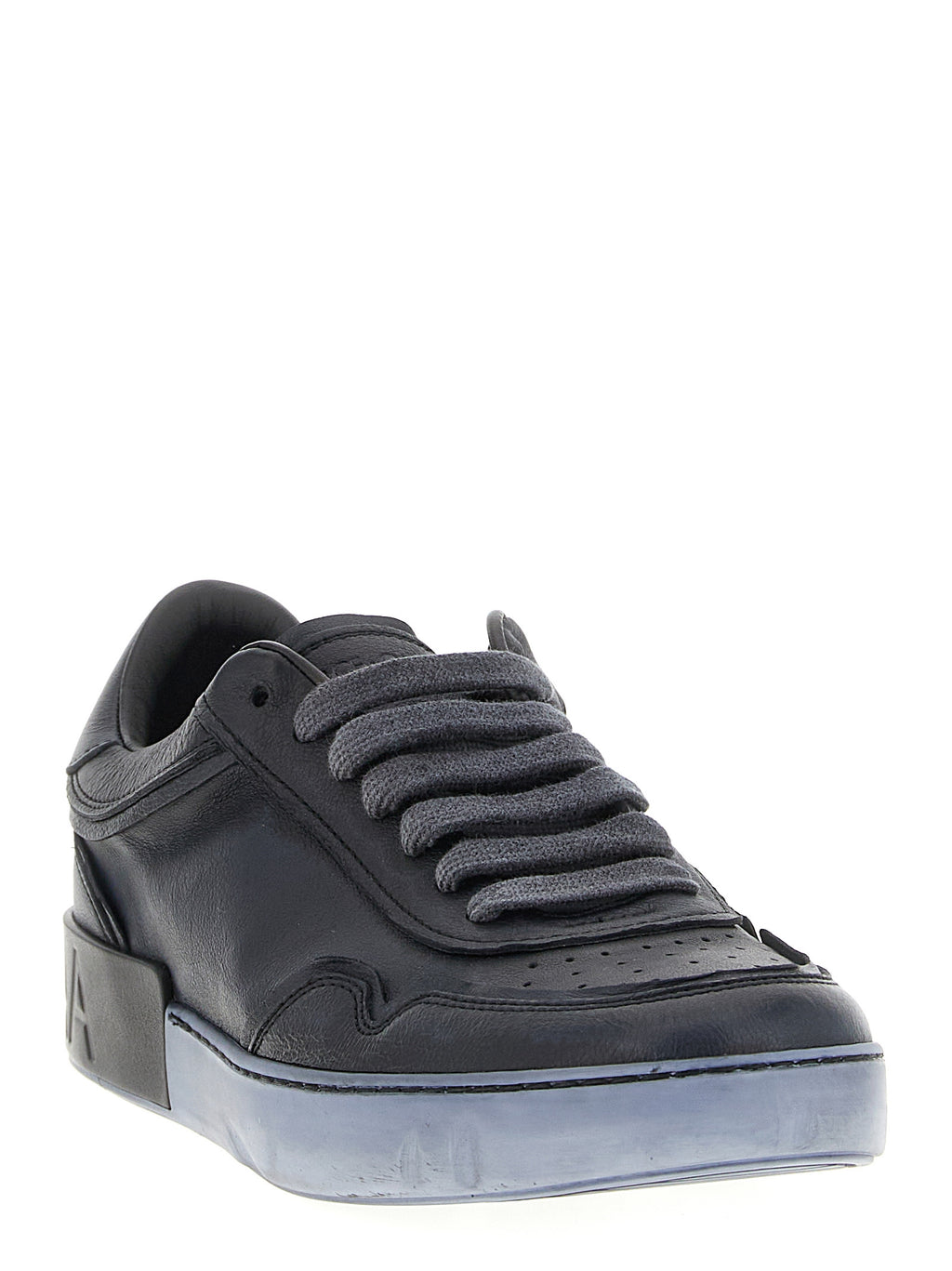 Baskets basses en cuir d'agneau noir de Dolce & Gabbana, avec semelle blanche, style élégant et moderne.