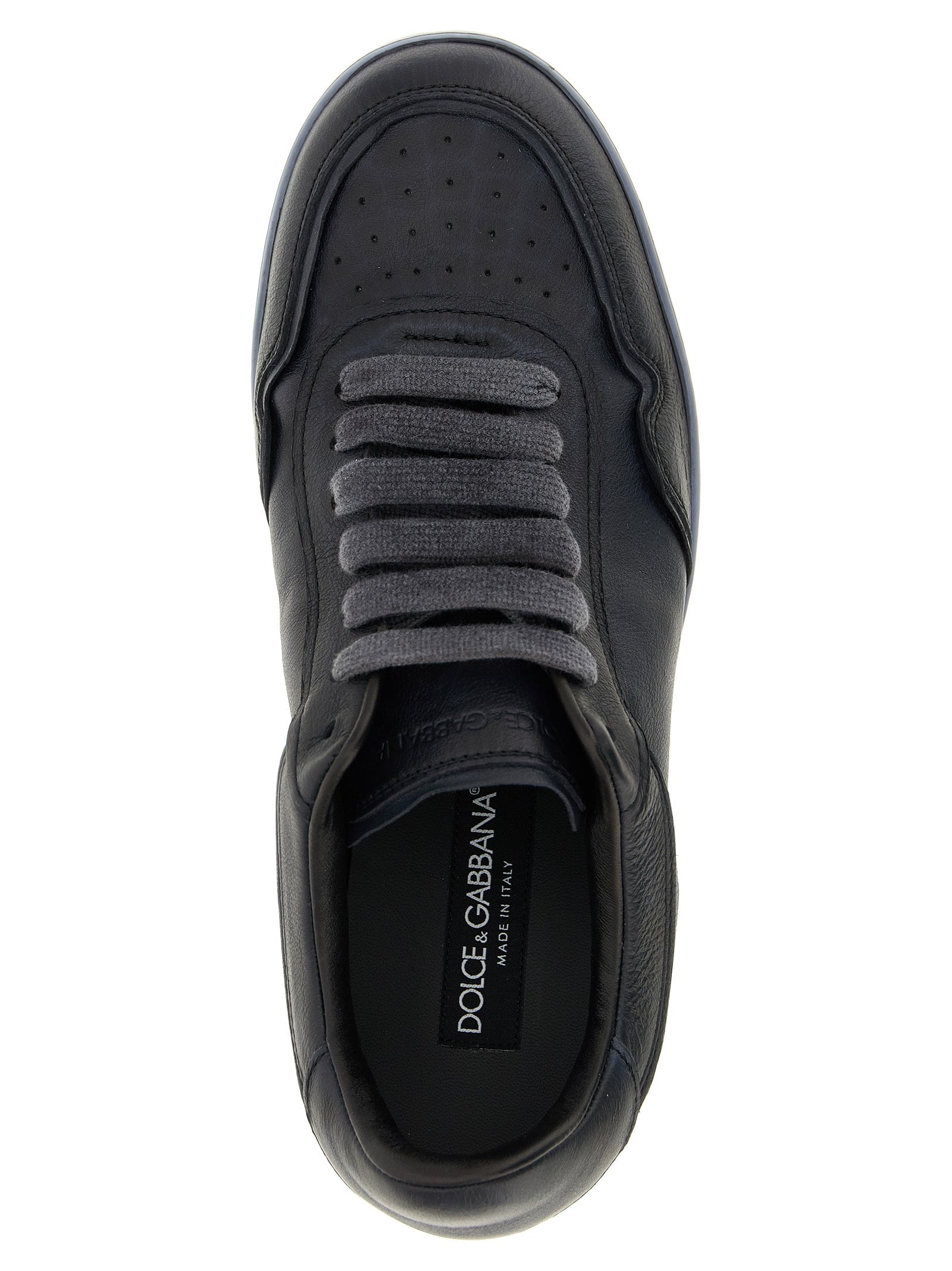 Sneakers basses en cuir d'agneau noir de Dolce & Gabbana, chausson élégant pour homme ou femme, vue de face.