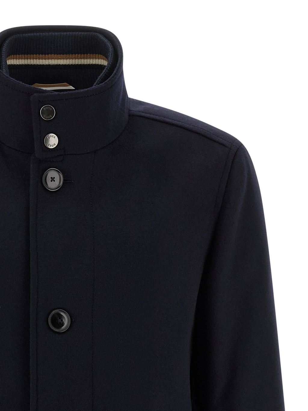 Manteau en laine bleu de Hugo Boss, coupe classique, porté sur un mannequin, détaillé avec col et boutons.