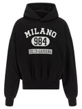 Sweatshirt en coton bicolore Dolce & Gabbana avec logo, style décontracté, porté par un mannequin avec un fond neutre.
