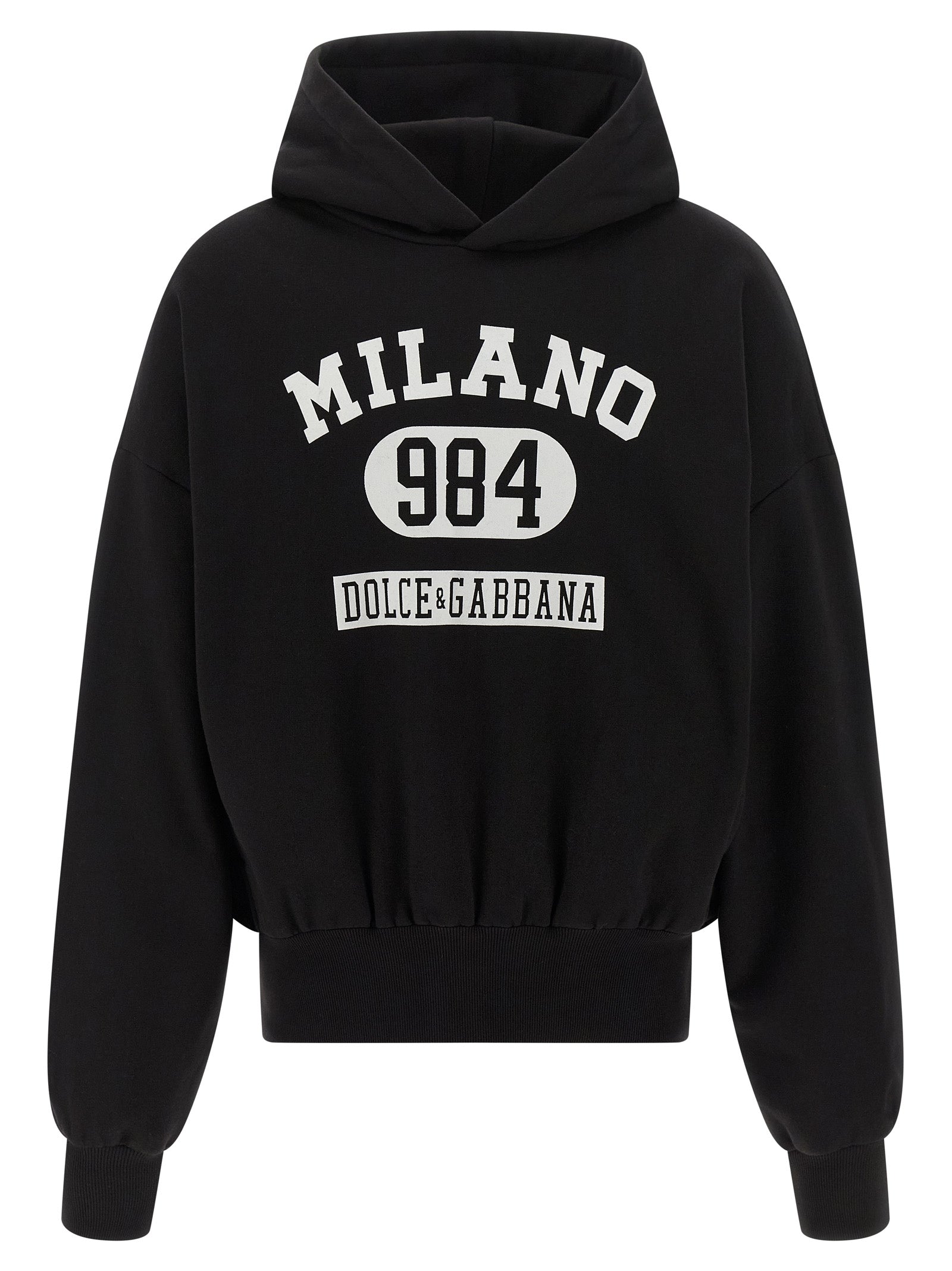 Sweatshirt en coton bicolore Dolce & Gabbana avec logo, style décontracté, porté par un mannequin avec un fond neutre.