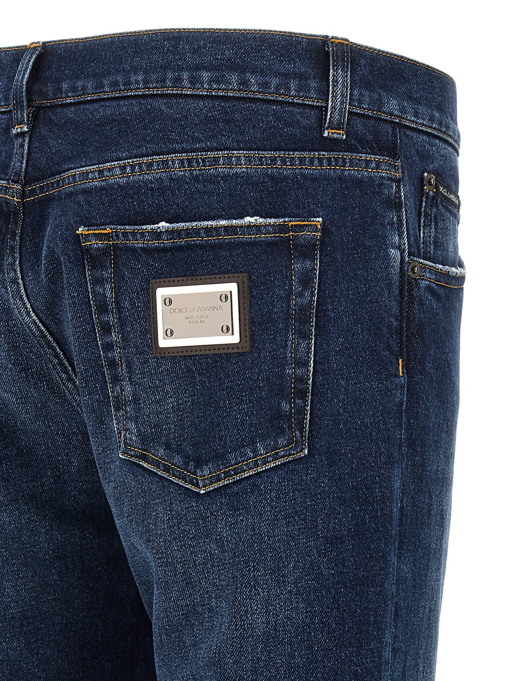 Jeans droits en coton bleu Dolce & Gabbana, vue de face, détails de la coupe et de la texture du tissu.