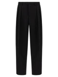 Pantalons de costume noirs en laine vierge Dolce & Gabbana pour homme, détails élégants et coupe classique.