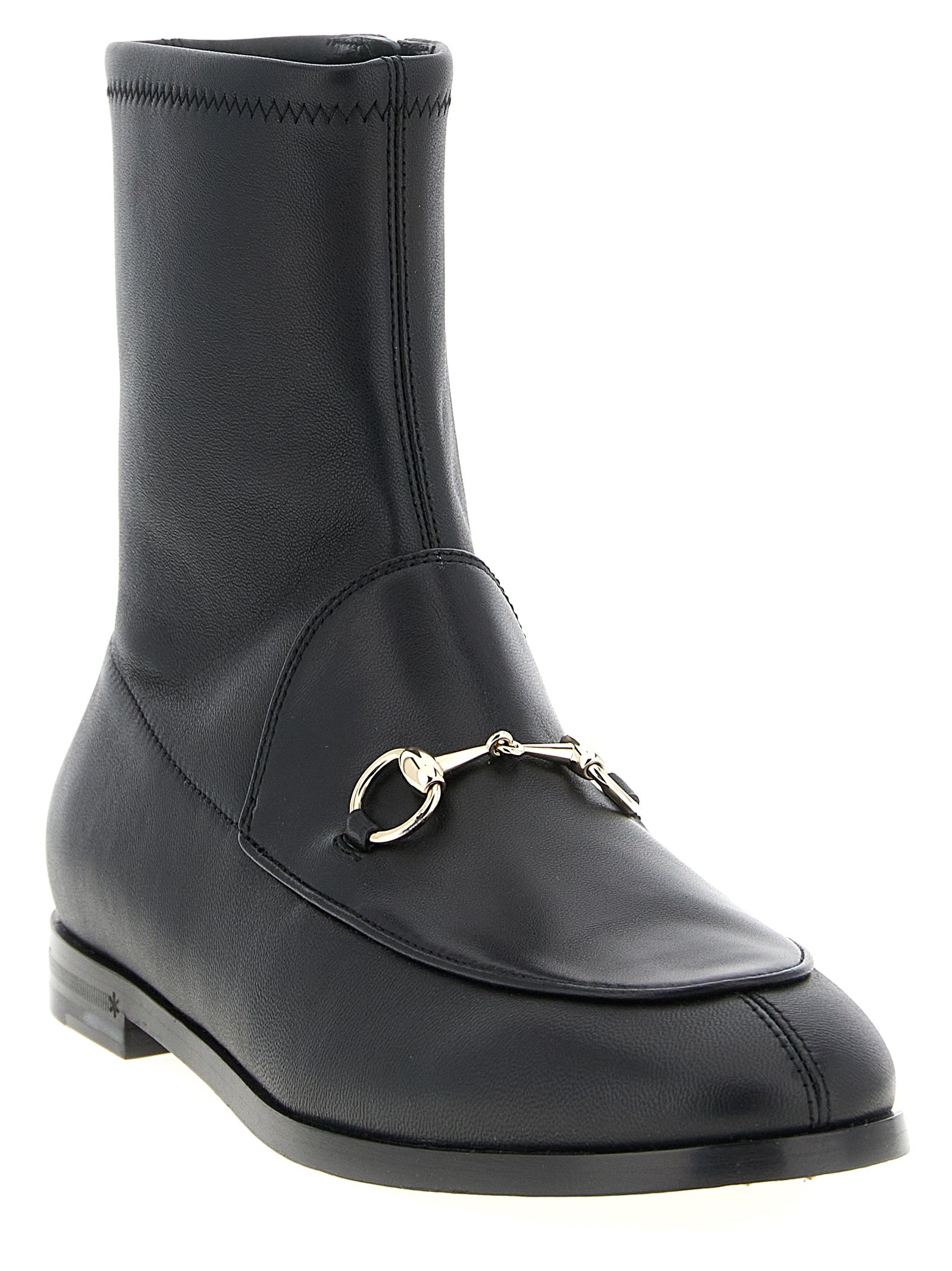 Bottines noires en cuir d'agneau Gucci, chaussures à la cheville élégantes avec talon et détails raffinés.