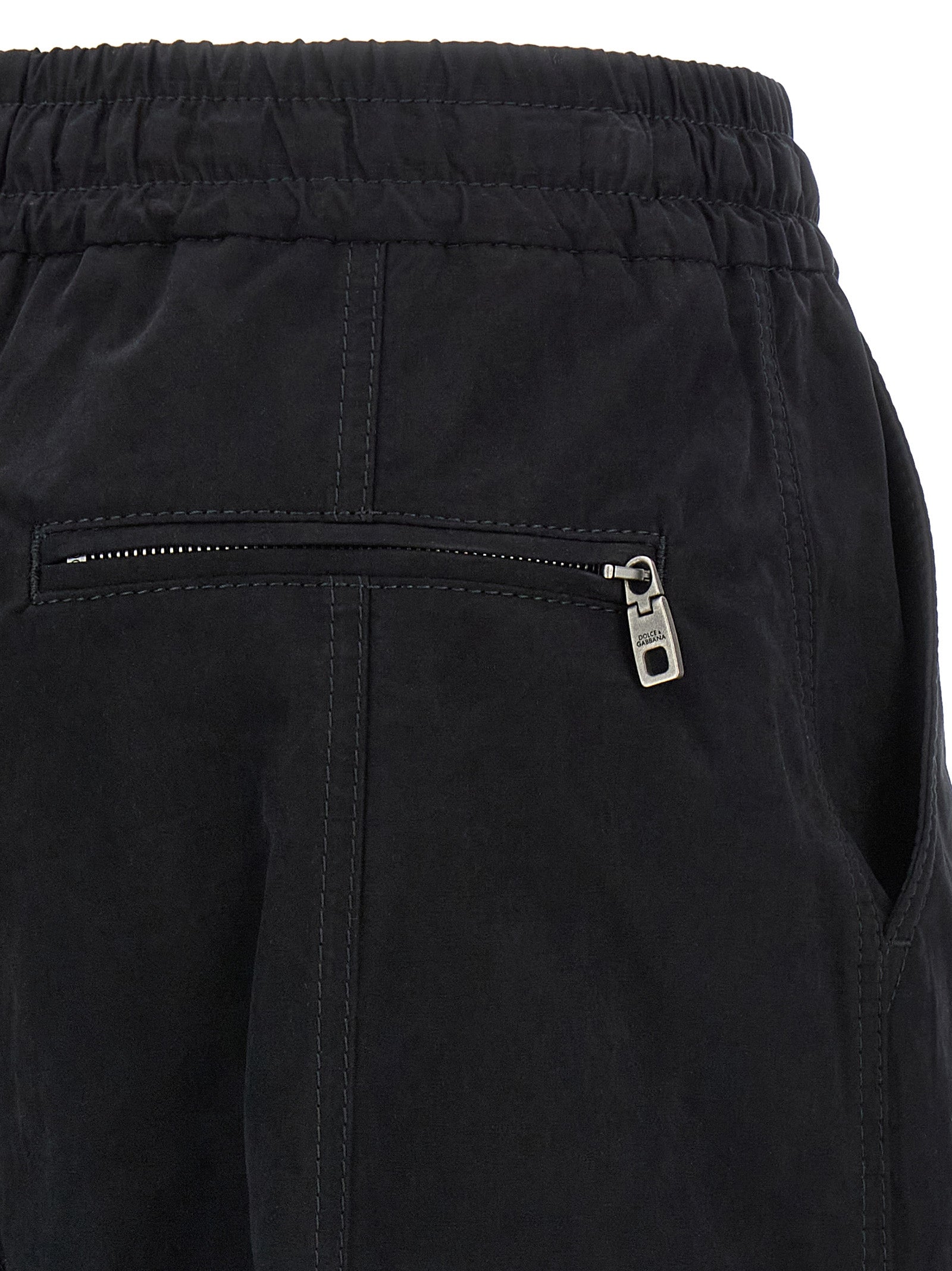 Pantalon cargo en coton noir de Dolce & Gabbana, style décontracté, avec poches latérales et coupe moderne.