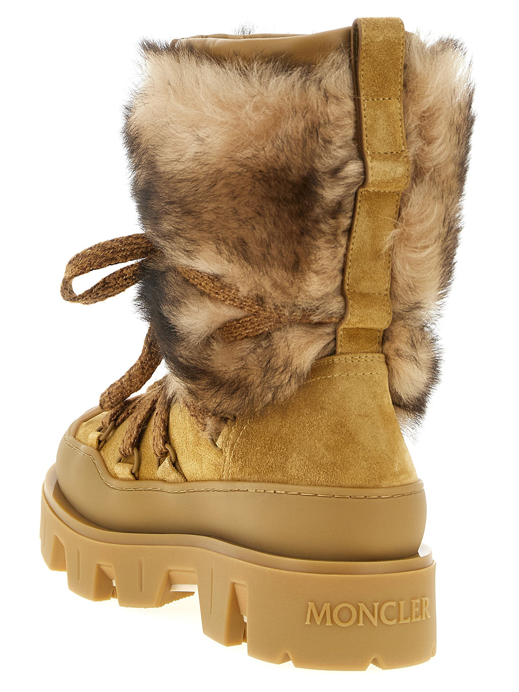 Bottes plates en veau marron Moncler pour femmes, silhouette élégante et finition en cuir de qualité.