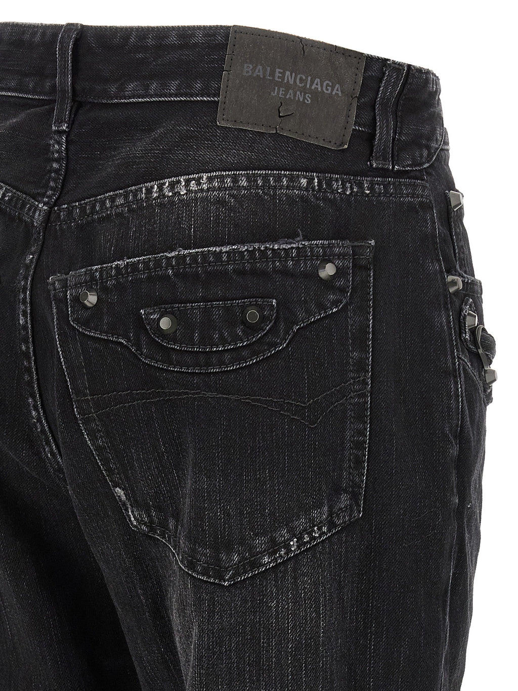 Jeans droits en coton noir de Balenciaga, style élégant et contemporain, affichés sur un mannequin.