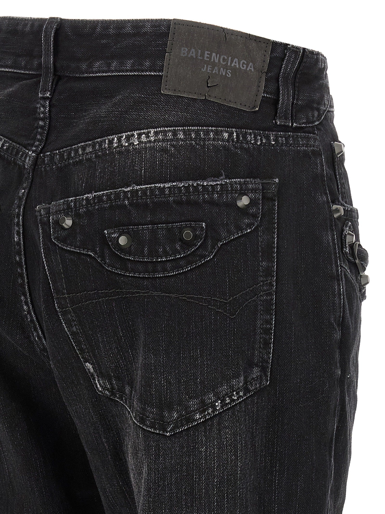 Jeans droits en coton noir de Balenciaga, style élégant et contemporain, affichés sur un mannequin.