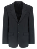 Veste blazer en laine noire de Balenciaga, élégante et moderne, portée sur un mannequin.