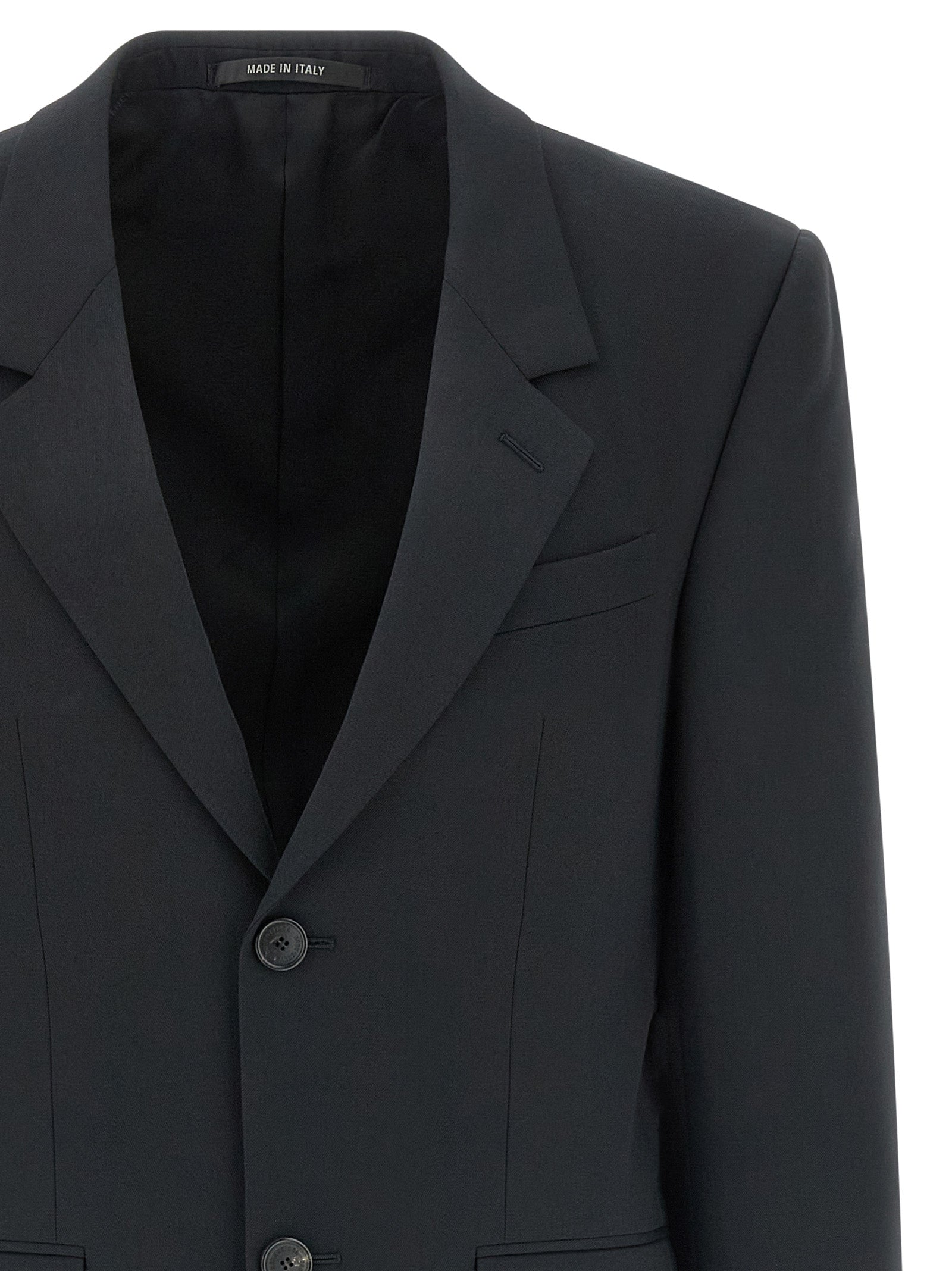Veste blazer en laine noire de Balenciaga, élégante et structurée, avec col classique et boutons sur le devant.