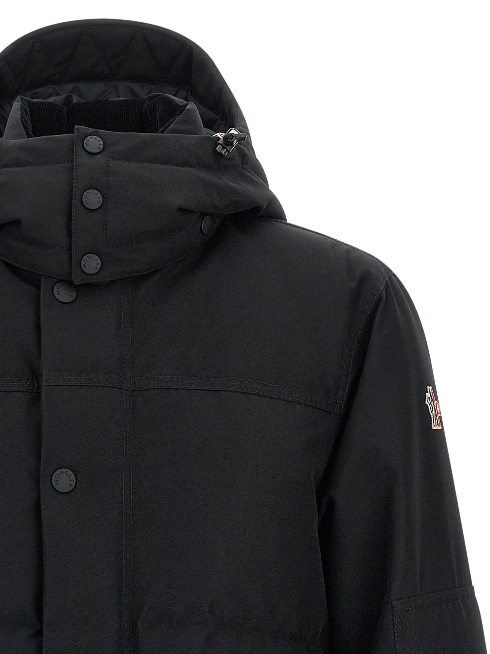 Veste shell en polyester noire Moncler Grenoble, coupe ajustée avec capuche et fermetures zippées, pour un style élégant et sportif.