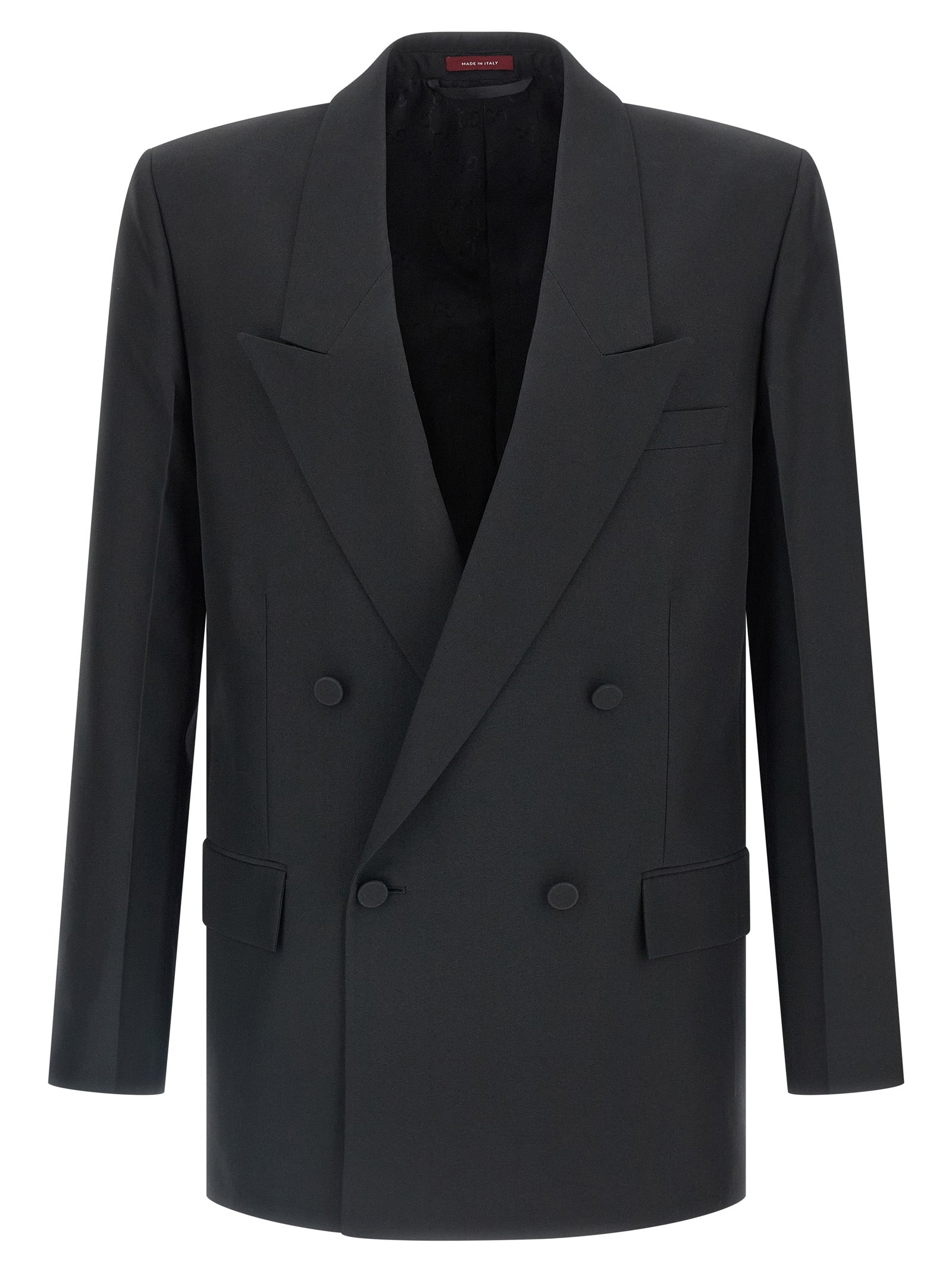 Blazer noir en polyester de Gucci, veste élégante avec coupe ajustée et détails modernes, portée sur un mannequin.