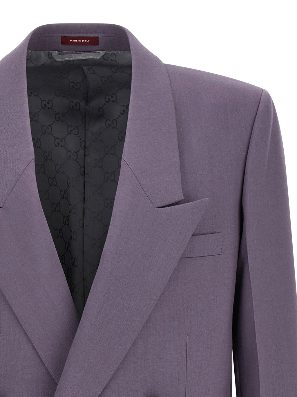 Veste en laine violette Gucci pour homme, coupe classique et détails élégants, portée sur un mannequin.