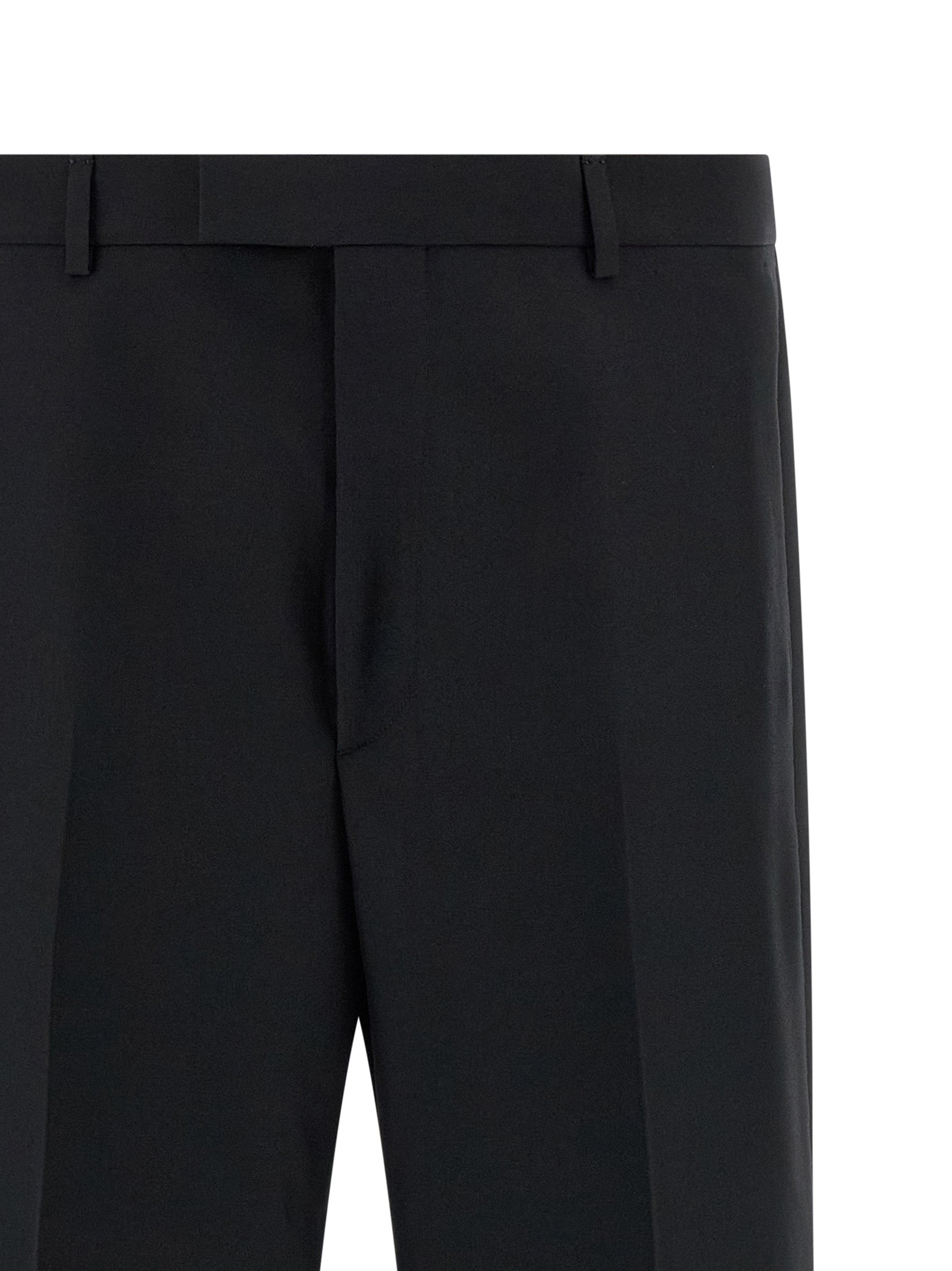 Pantalon de costume en polyester noir Gucci pour homme, élégant et classique, visible avec une coupe bien ajustée.