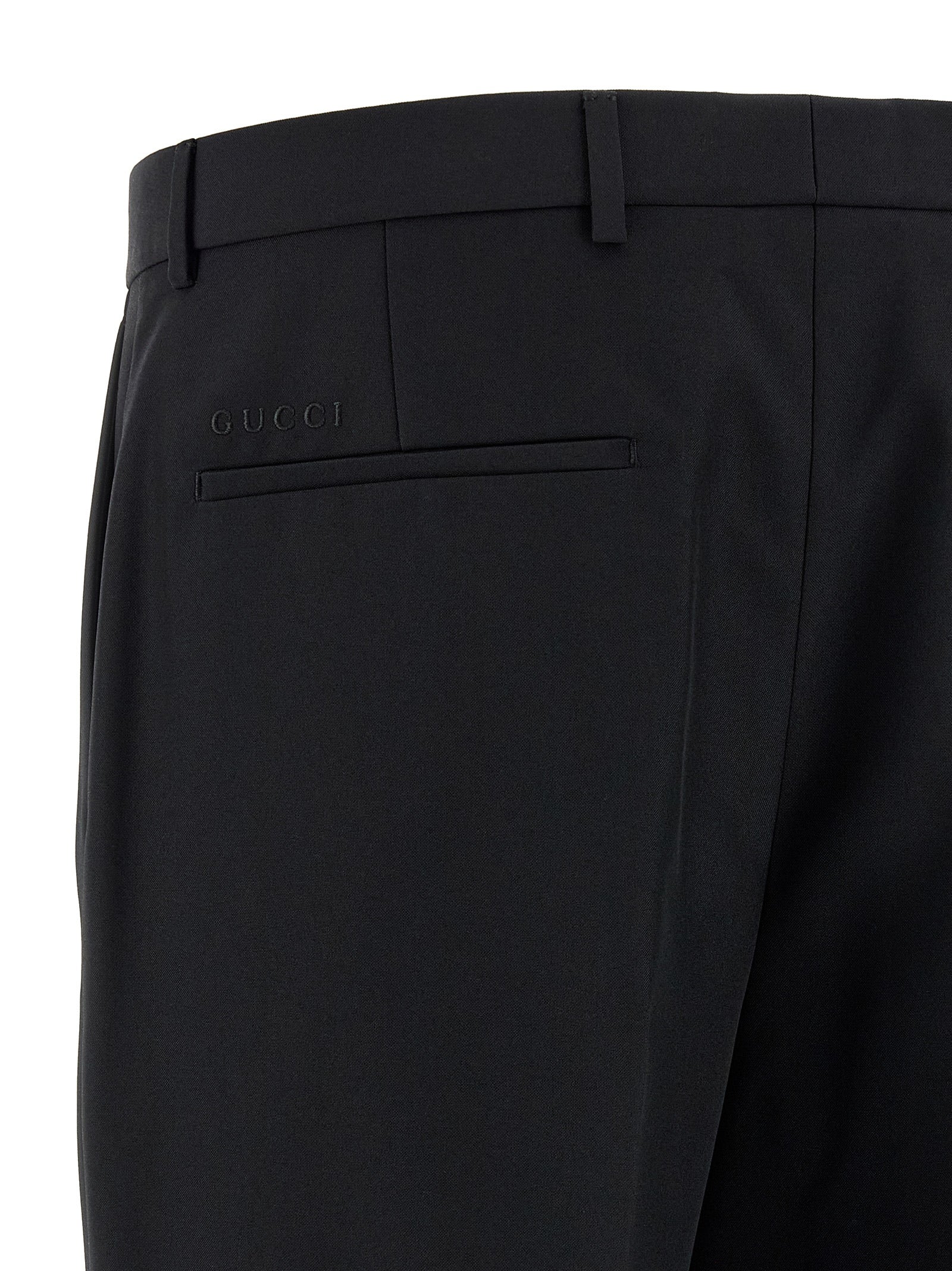 Pantalon de costume en polyester noir Gucci pour femme, avec une coupe élégante et détails raffinés.