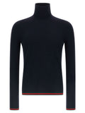 Cardigan en cachemire bleu Gucci, vue de face, avec détails du tissu et logo Gucci visible.