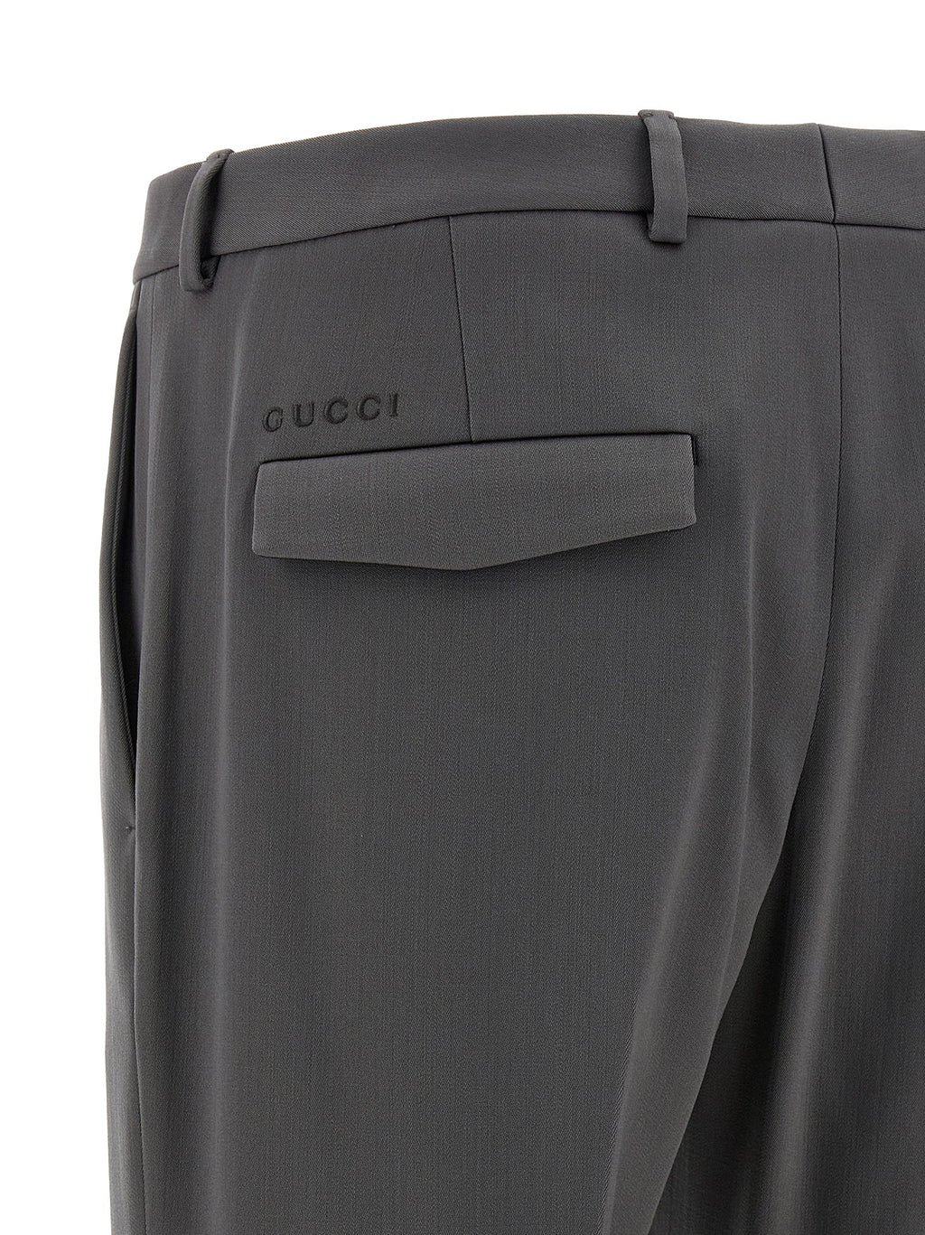 Pantalon en laine gris Gucci pour femme, coupe élégante et classique, visible en détail sur fond neutre.