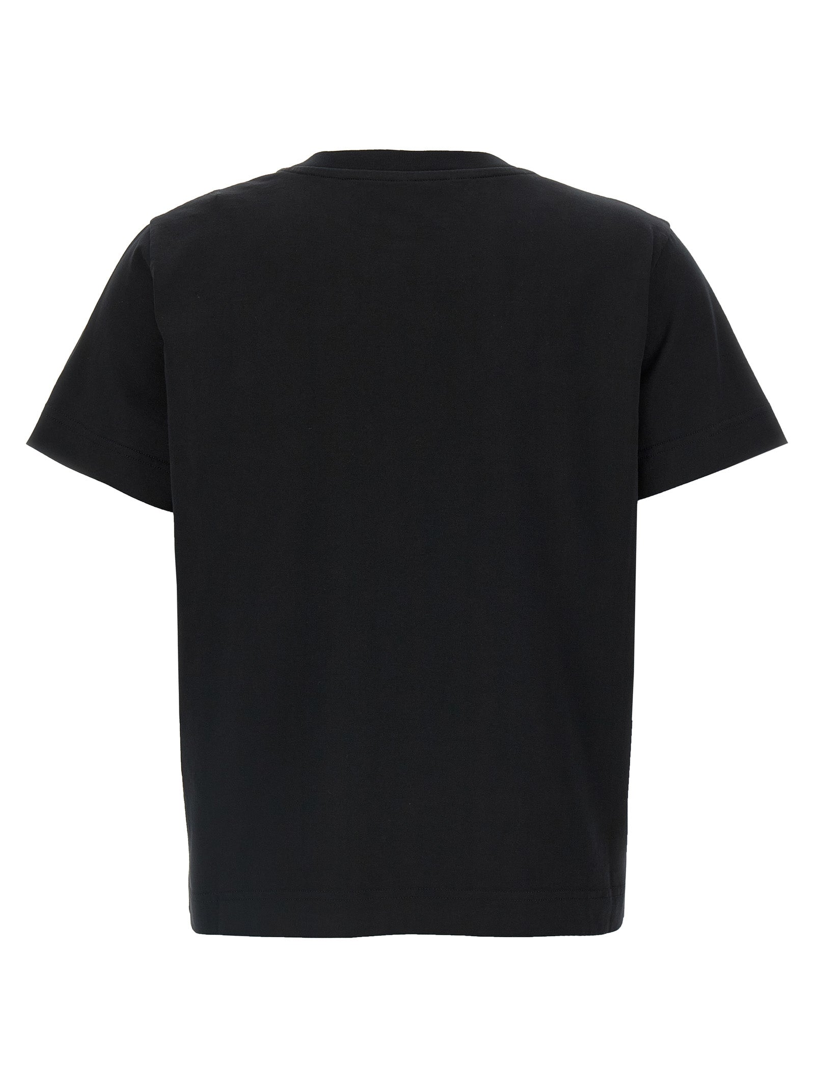 T-shirt noir en coton Givenchy, vêtement décontracté avec logo discret, porté sur un mannequin.