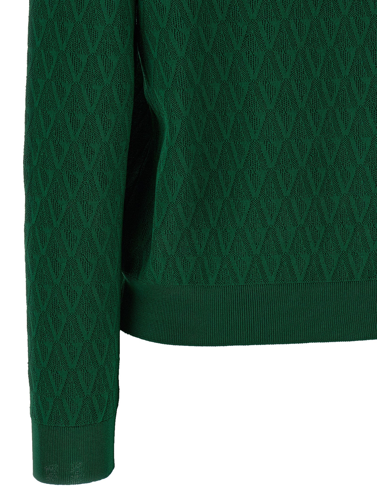 Cardigan bicolore en viscose de la marque Versace, avec un design élégant et moderne, visible en détail sur l'image.