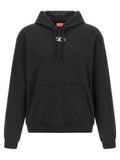 Sweat-shirt en coton noir Diesel, coupe décontractée, avec logo Diesel imprimé sur la poitrine, porté par un modèle.