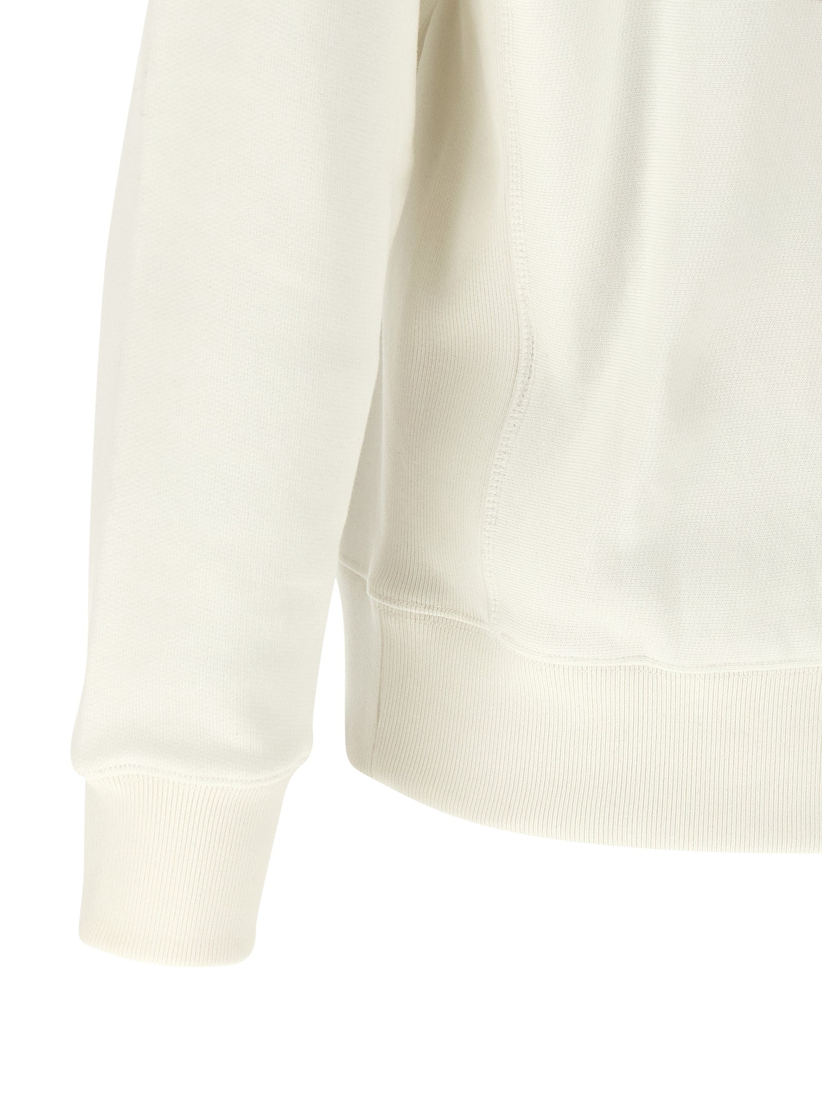 Sweat-shirt blanc en coton de la marque Kenzo, avec logo visible sur la poitrine, porté par un mannequin.